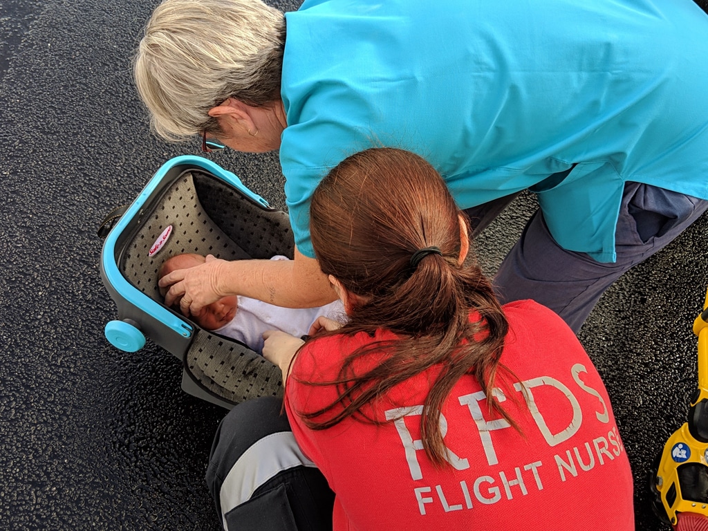 RFDS Flight Nurse attending to Baby Zac