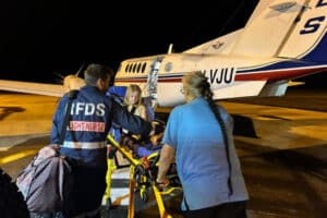 Flying Doctor Flight Nurse and transporting a patient to an RFDS plane