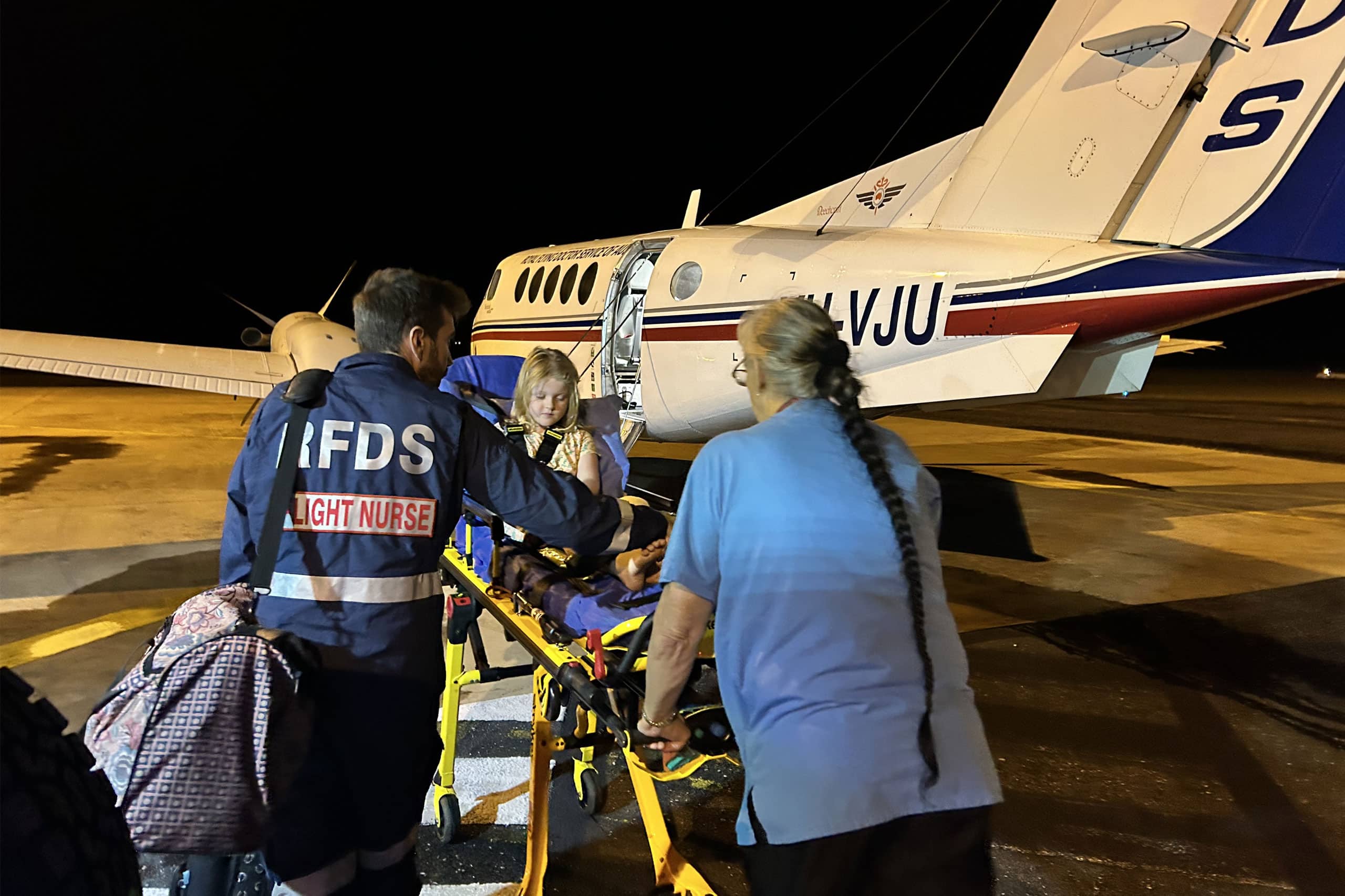 Flying Doctor Flight Nurse and transporting a patient to an RFDS plane